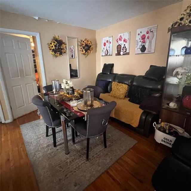 dining room with dark hardwood / wood-style flooring