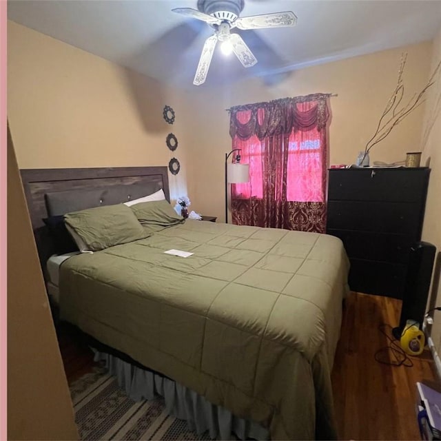 bedroom featuring ceiling fan and wood-type flooring