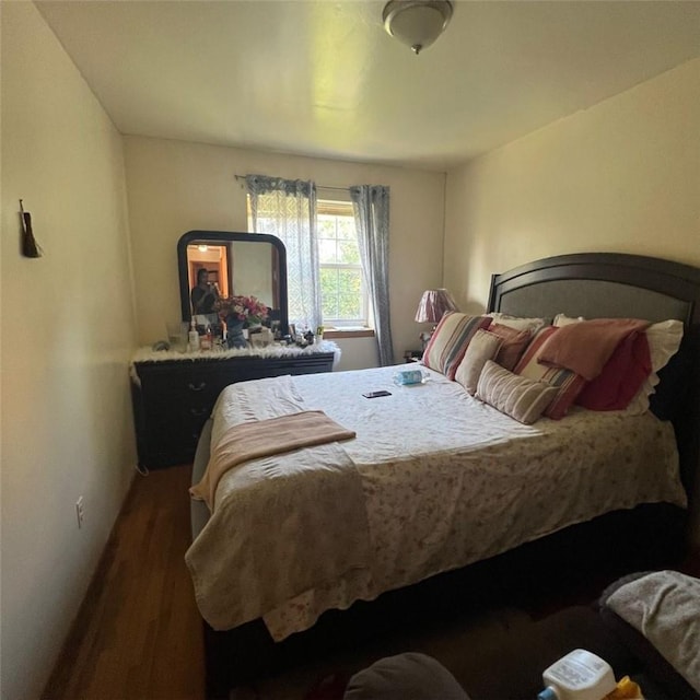 bedroom featuring dark hardwood / wood-style floors