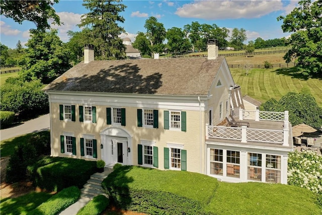 20 Smithfield Way, Amenia, NY 12501 - view of front of home with a chimney, a balcony, and a front lawn