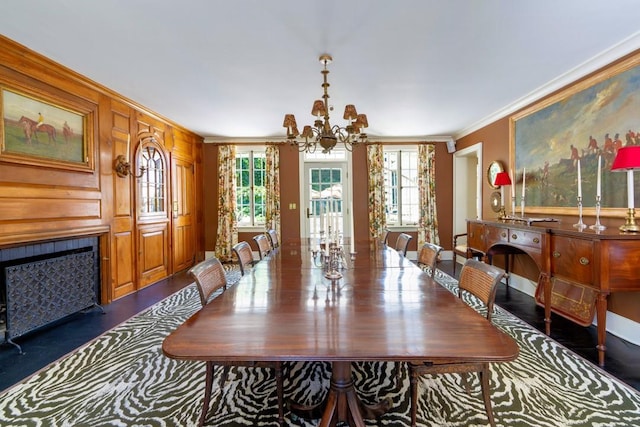 20 Smithfield Way, Amenia, NY 12501 - dining space featuring a chandelier, crown molding, plenty of natural light, and a fireplace with flush hearth