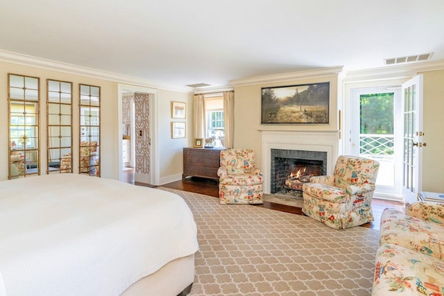 20 Smithfield Way, Amenia, NY 12501 - bedroom featuring access to exterior, ornamental molding, a fireplace with flush hearth, and multiple windows