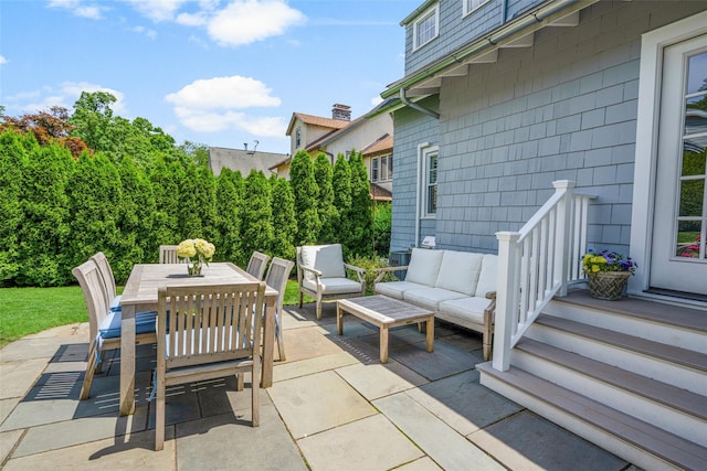 view of patio with outdoor dining space and an outdoor living space