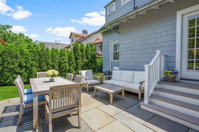 view of patio with outdoor dining area and outdoor lounge area