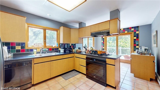 kitchen featuring sink, tasteful backsplash, kitchen peninsula, light tile patterned floors, and black appliances