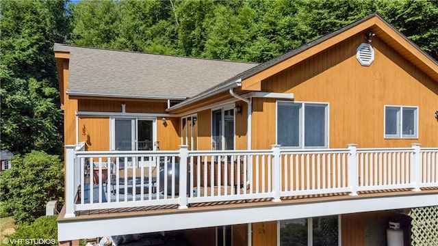 back of house with a balcony