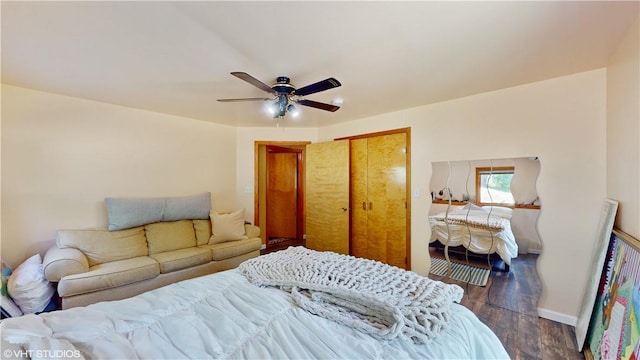 bedroom featuring dark hardwood / wood-style flooring, a closet, and ceiling fan