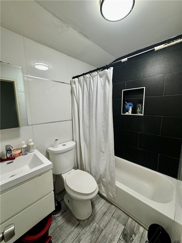 full bathroom with vanity, toilet, and shower / tub combo with curtain