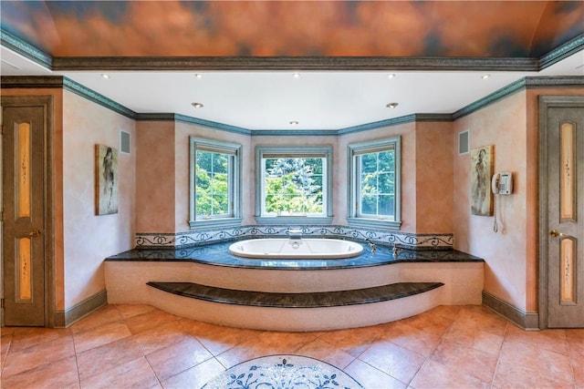 bathroom featuring tile patterned floors, a wealth of natural light, crown molding, and a tub to relax in