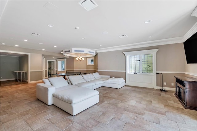 living room with crown molding and a notable chandelier