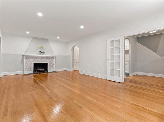 unfurnished living room featuring light hardwood / wood-style floors