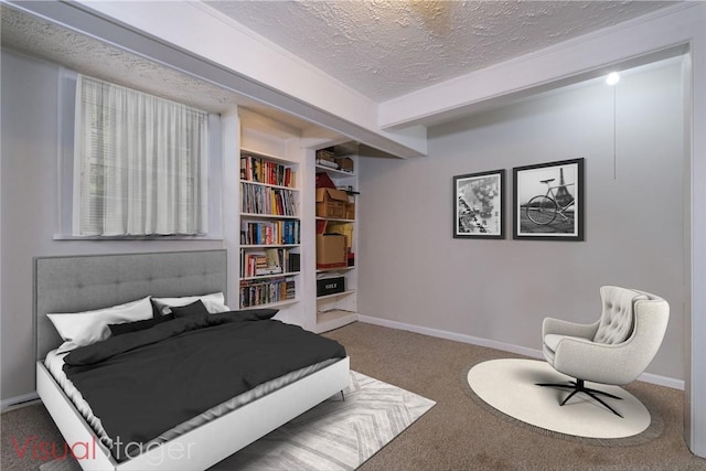 carpeted bedroom featuring a textured ceiling