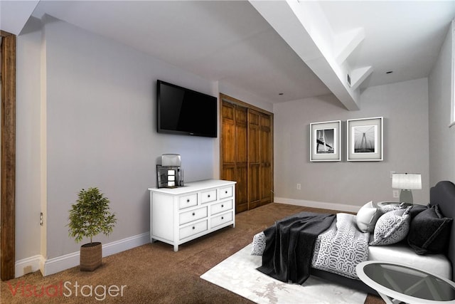 bedroom featuring dark carpet and a closet