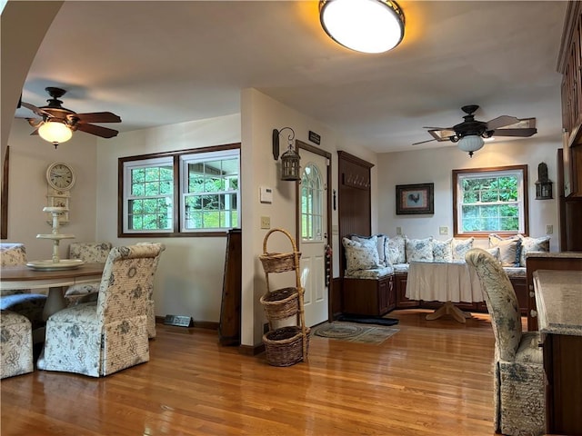 437 Lindholm Rd, Fallsburg, NY 12747 - dining room featuring a ceiling fan, light wood finished floors, and baseboards