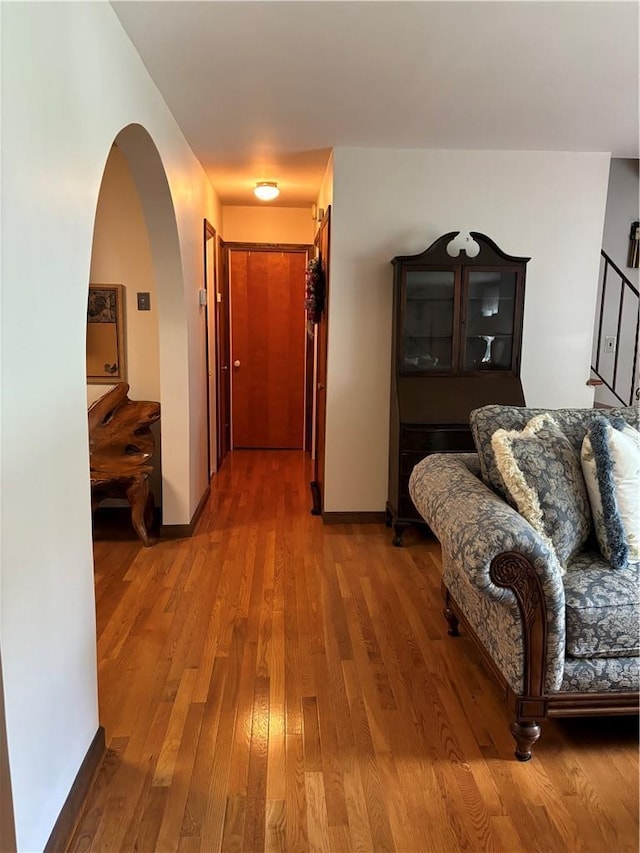 437 Lindholm Rd, Fallsburg, NY 12747 - hall with wood finished floors, baseboards, and arched walkways