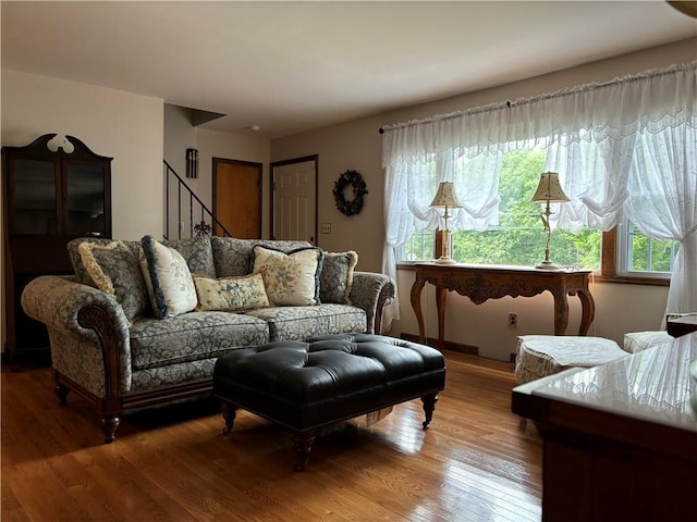 437 Lindholm Rd, Fallsburg, NY 12747 - living room with plenty of natural light, wood finished floors, and stairs
