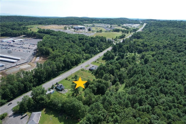 275-277 State Route 17b, Monticello, NY 12701 - birds eye view of property featuring a wooded view