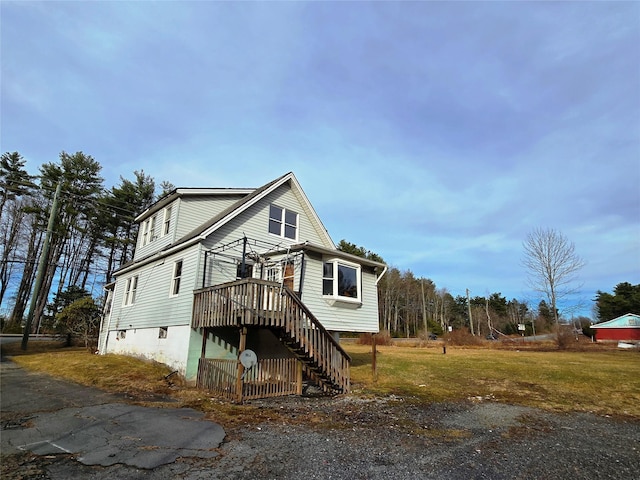 275-277 State Route 17b, Monticello, NY 12701 - exterior space featuring a deck, a yard, and stairs