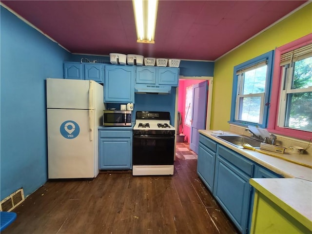 275-277 State Route 17b, Monticello, NY 12701 - kitchen featuring stainless steel microwave, freestanding refrigerator, under cabinet range hood, visible vents, and range with gas stovetop