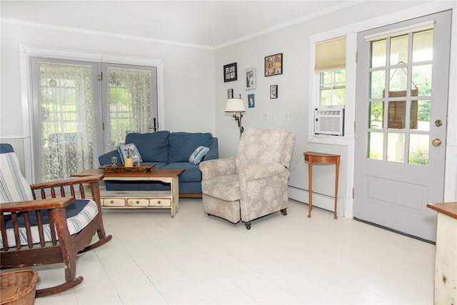 sitting room featuring cooling unit, baseboard heating, and ornamental molding