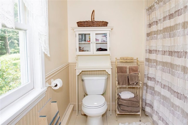 bathroom with tile patterned floors and toilet