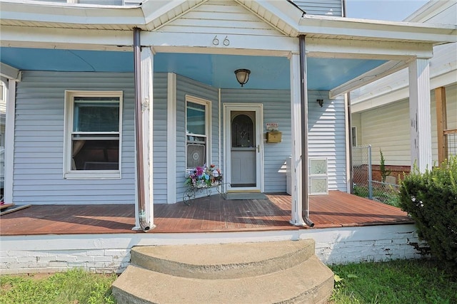 doorway to property with a porch