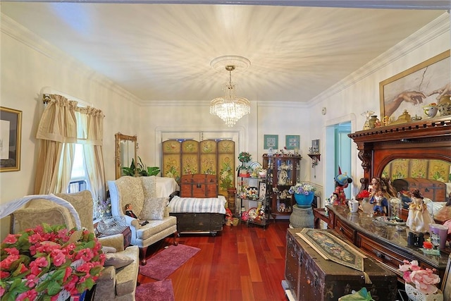 living area featuring a notable chandelier, ornamental molding, and dark wood-type flooring