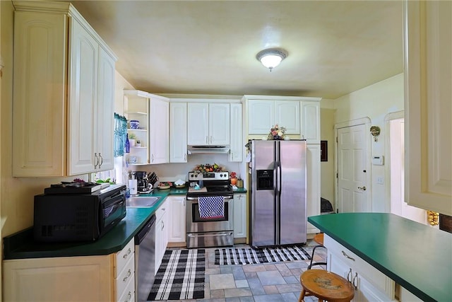 kitchen with white cabinetry and appliances with stainless steel finishes