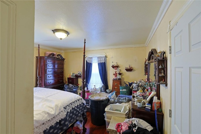 bedroom featuring crown molding, a textured ceiling, and hardwood / wood-style flooring