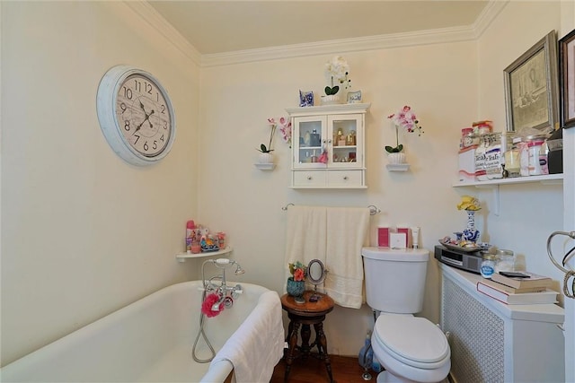 bathroom with a bath, toilet, and crown molding