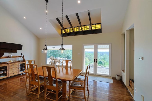 dining room with french doors, high vaulted ceiling, and dark hardwood / wood-style floors