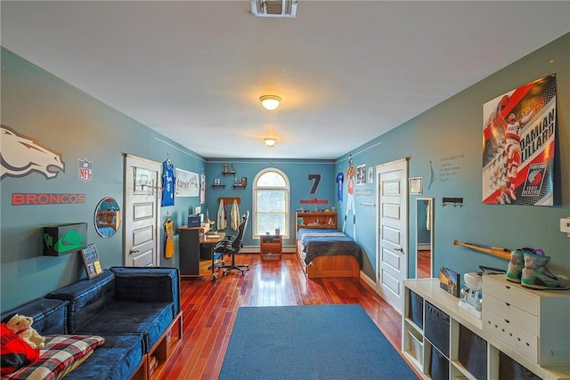 bedroom featuring hardwood / wood-style floors