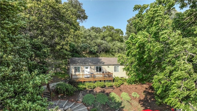 rear view of property with a deck