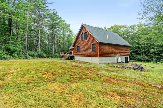 view of home's exterior with a yard