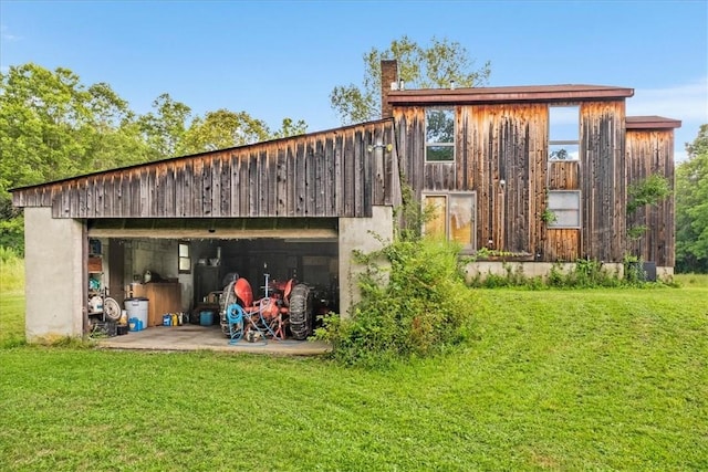 view of outbuilding with a lawn