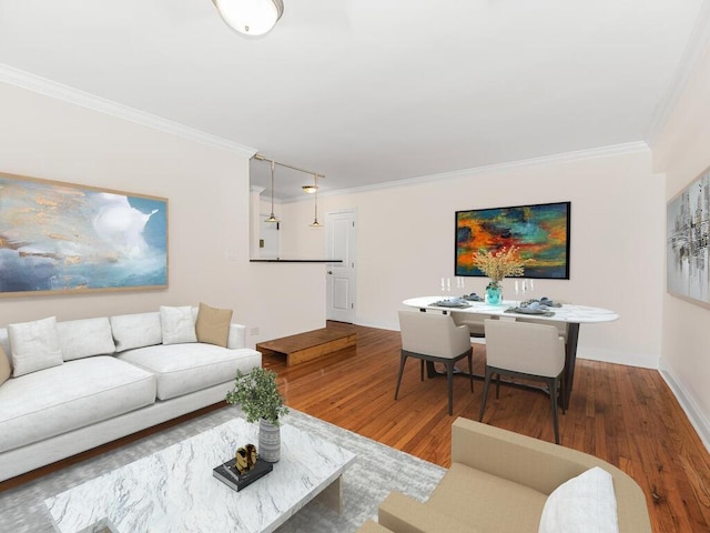 living room featuring hardwood / wood-style floors and crown molding