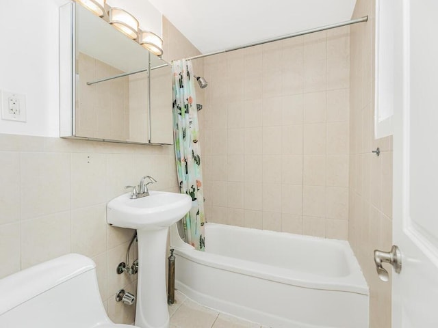 full bathroom featuring shower / tub combo, sink, tile walls, tile patterned flooring, and toilet