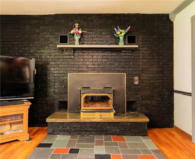 details with hardwood / wood-style flooring and ornamental molding