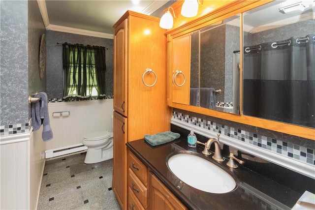 bathroom with vanity, crown molding, decorative backsplash, toilet, and baseboard heating