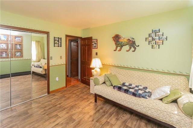 bedroom with a closet and wood-type flooring