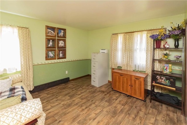 living area with hardwood / wood-style floors