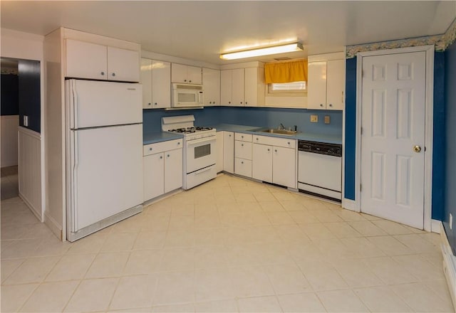 kitchen with white cabinets, white appliances, and sink