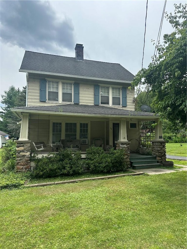 view of front of home with a front lawn and covered porch