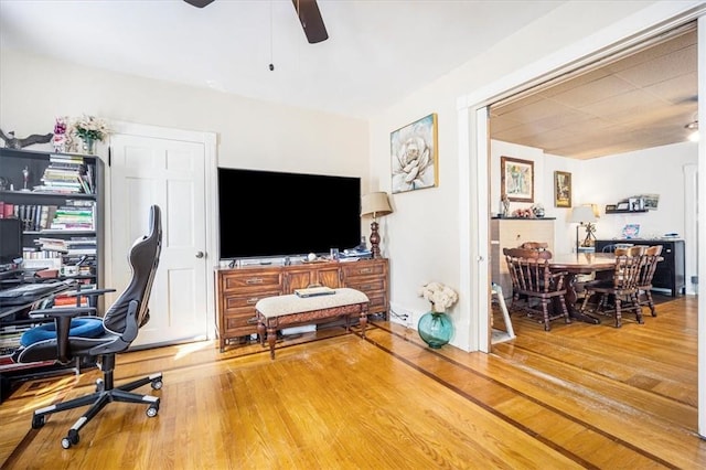 office space with hardwood / wood-style floors and ceiling fan