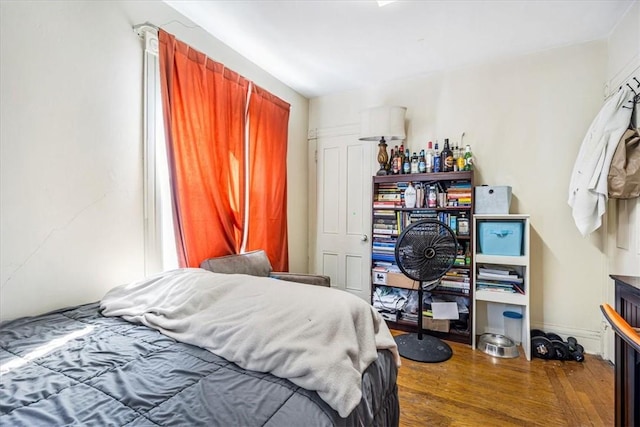 bedroom with wood-type flooring