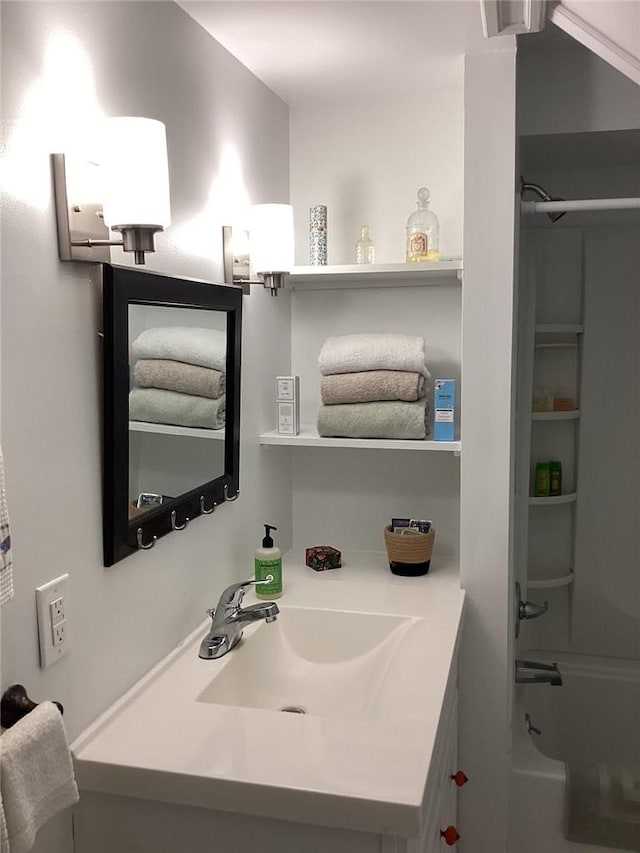 bathroom with vanity and bathing tub / shower combination