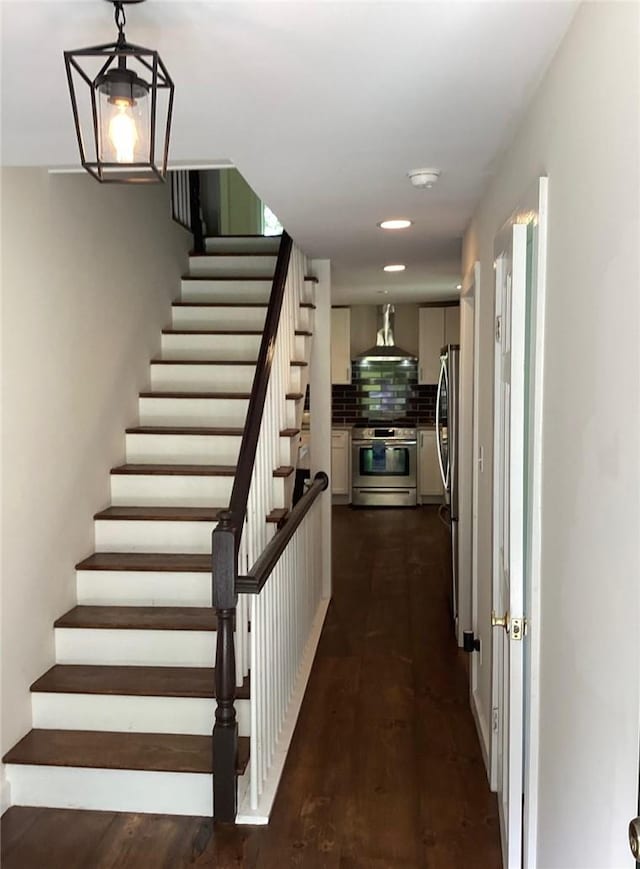 staircase featuring hardwood / wood-style floors