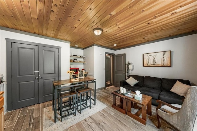 living room with light hardwood / wood-style flooring and wood ceiling