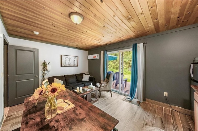 living room featuring light hardwood / wood-style floors, an AC wall unit, and wood ceiling