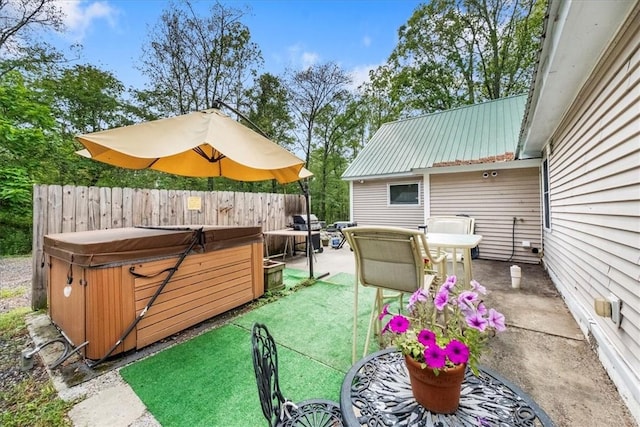 view of patio featuring area for grilling and a hot tub